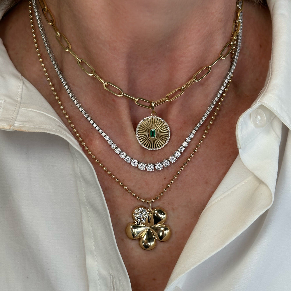
                  
                    Fluted Emerald Diamond Charm
                  
                
