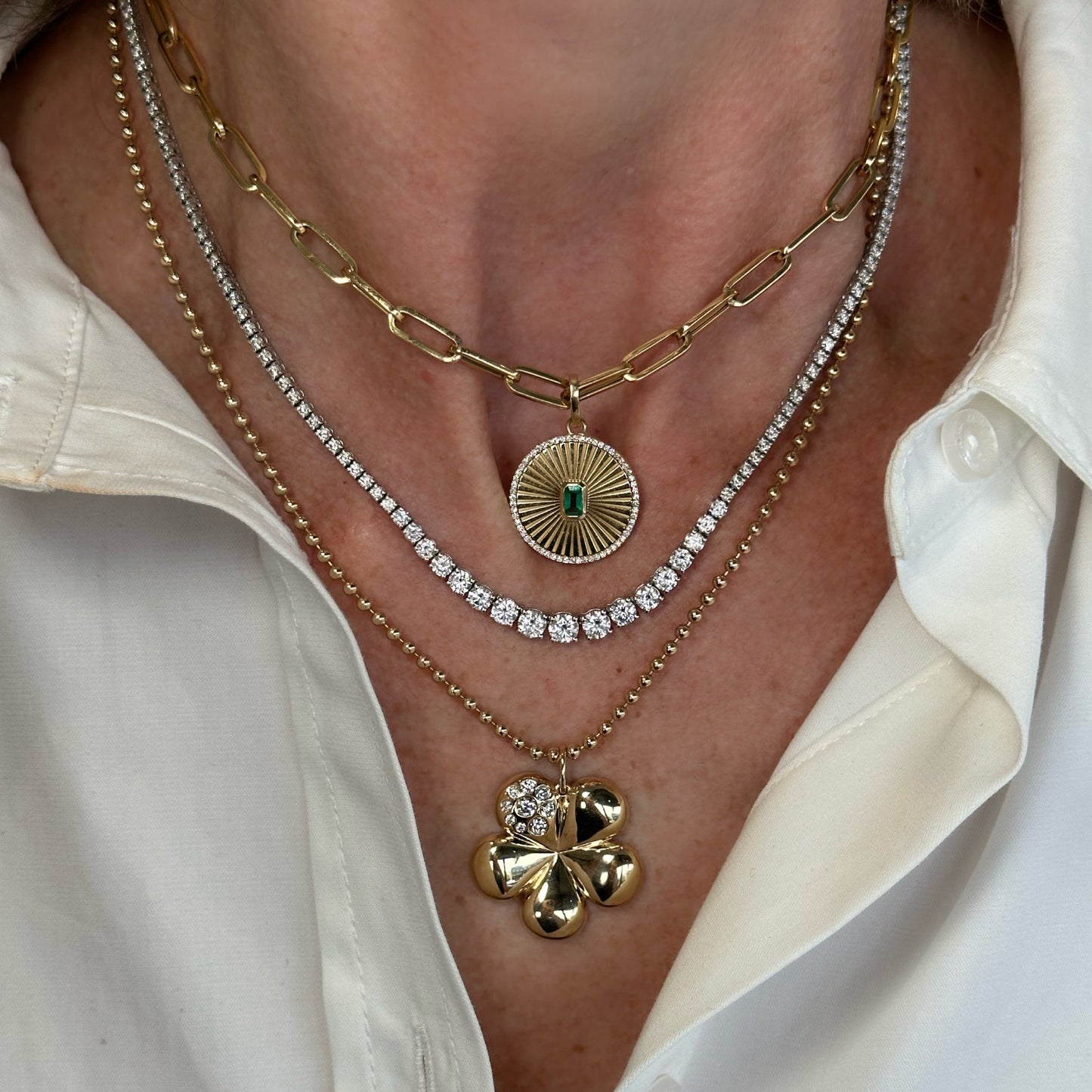 
                  
                    Fluted Emerald Diamond Charm
                  
                