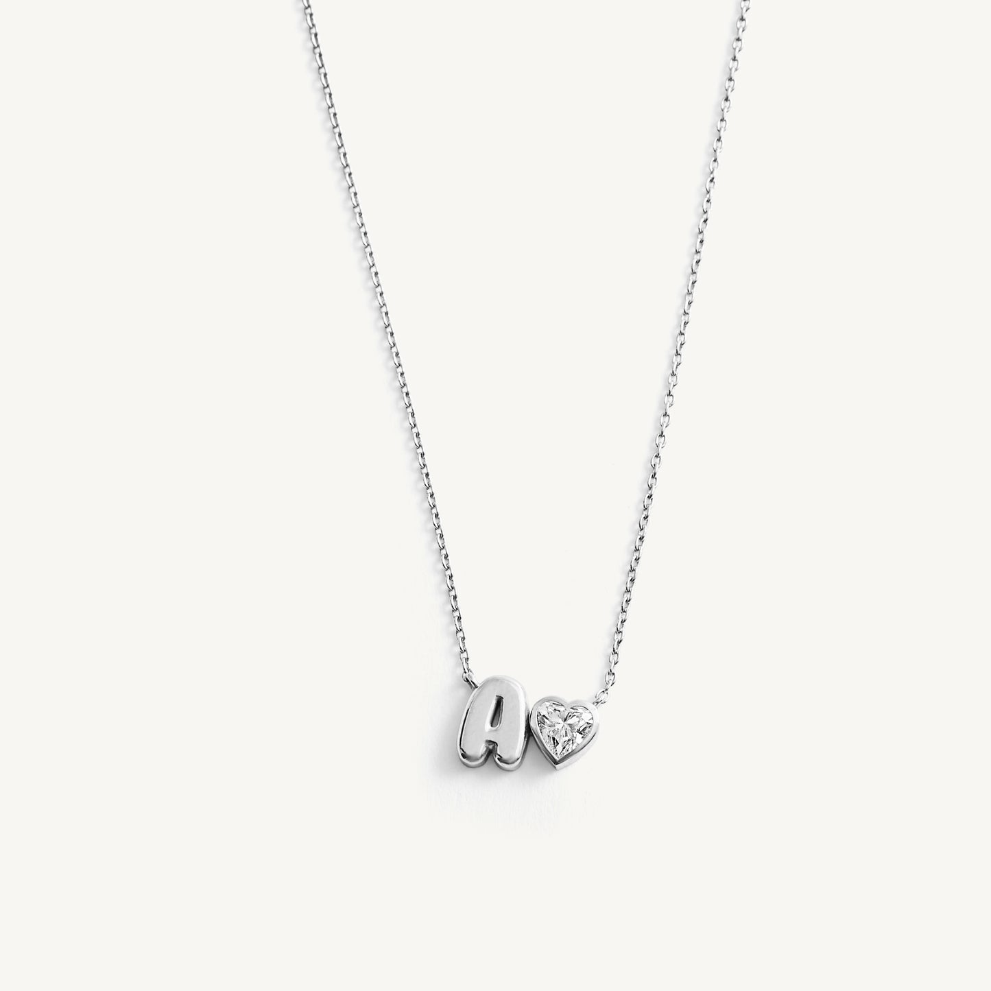 
                  
                    Helium Initial with Bezel Heart Diamond
                  
                